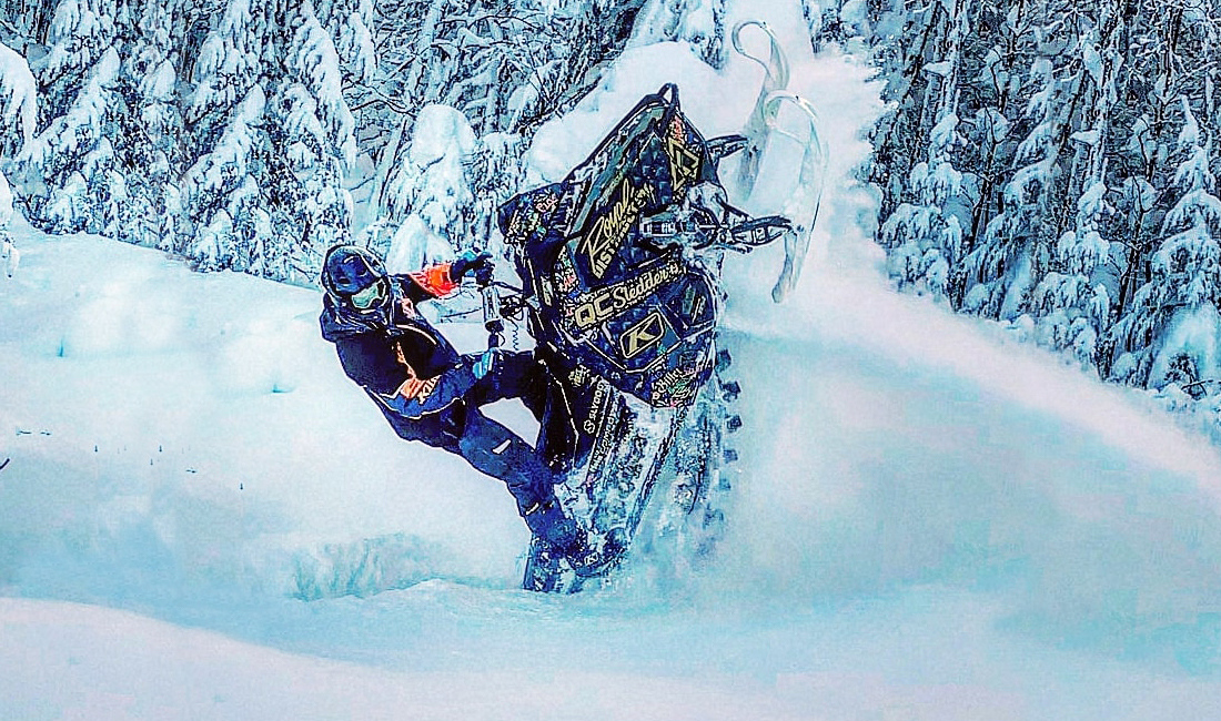 Cedrik Moreau ridding a snowmobile