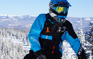 Justin Ponsor riding a Snowmobile