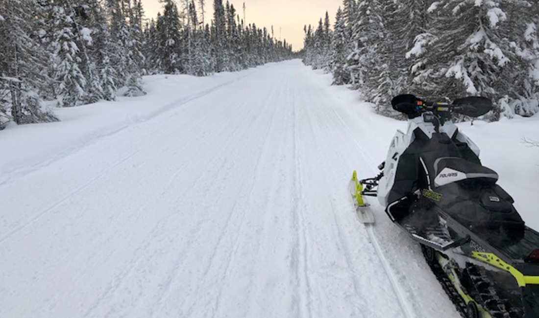Matt Krengel riding a Snowmobile