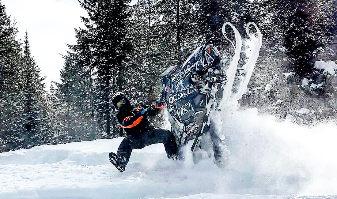 Cedrik Moreau ridding a snowmobile