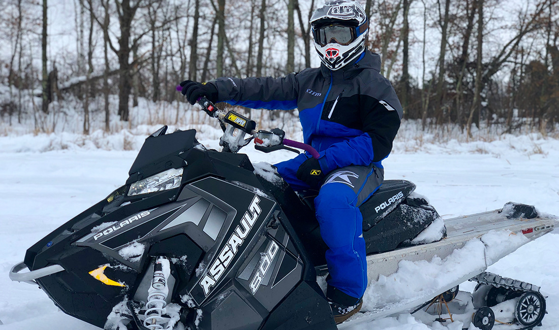 Tucker Trettel riding a Snowmobile