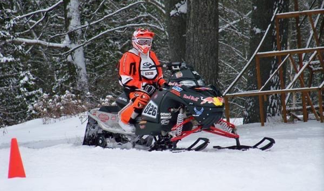 Alexandre Bélanger riding a Snowmobile