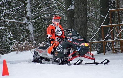 Alexandre Bélanger riding a Snowmobile