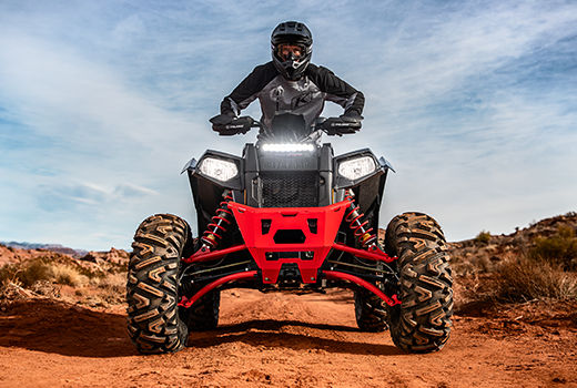 RZR 570 going down a green trail road