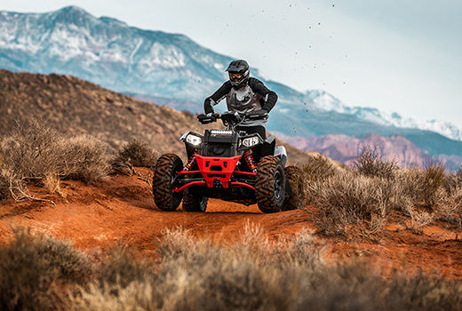 RZR 570 going down a green trail road