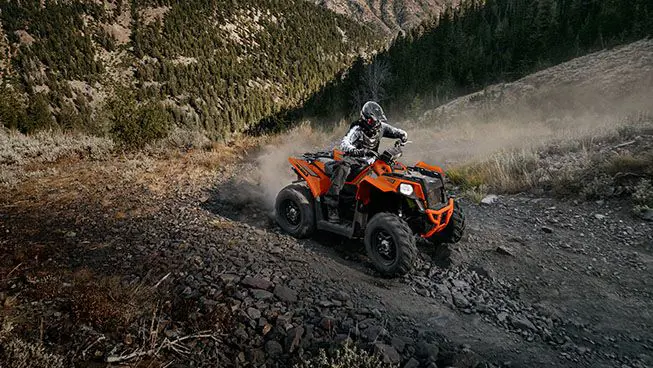 Polaris Scrambler 850 off-roading on rocky terrain
