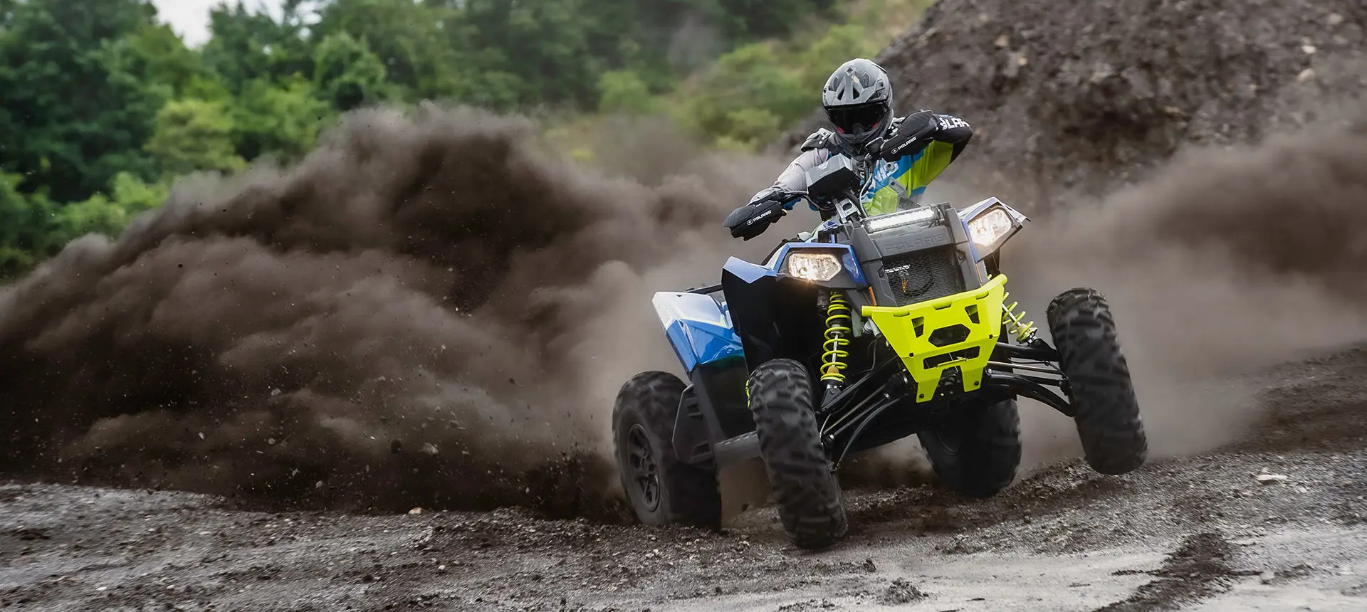 Scrambler XP 1000 S atv throwing gravel on a trail