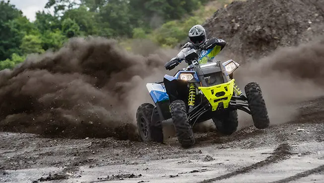 Scrambler XP 1000 S atv throwing gravel on a trail