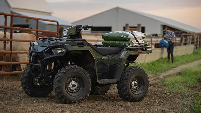 Sportsman 450 with two bags attached