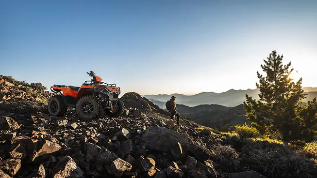 Polaris sportsman 570 ultimate trail limited edition atv parked on a rocky hillside