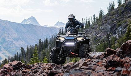Sportsman 570 riding over rocky terrain with ease