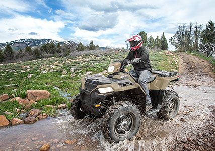 taking a puddle with the 11.5 inch ground clearance on the sportsman 850