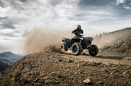 rider speeding down a hill on his sportsman xp 1000 s with unmatched handling
