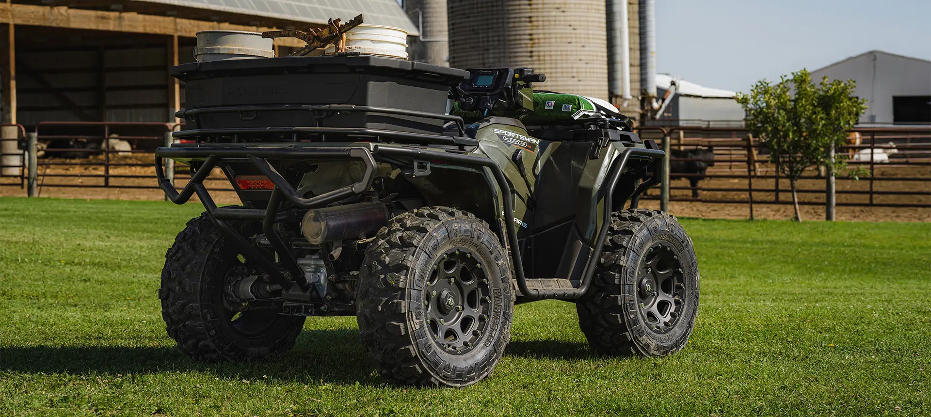 sportsman 450 utility atv parked on a farm