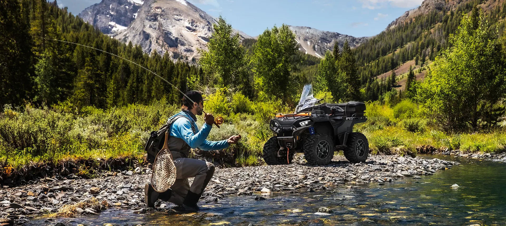 2 people relaxing after a ride on their polaris sportsman 570 atvs