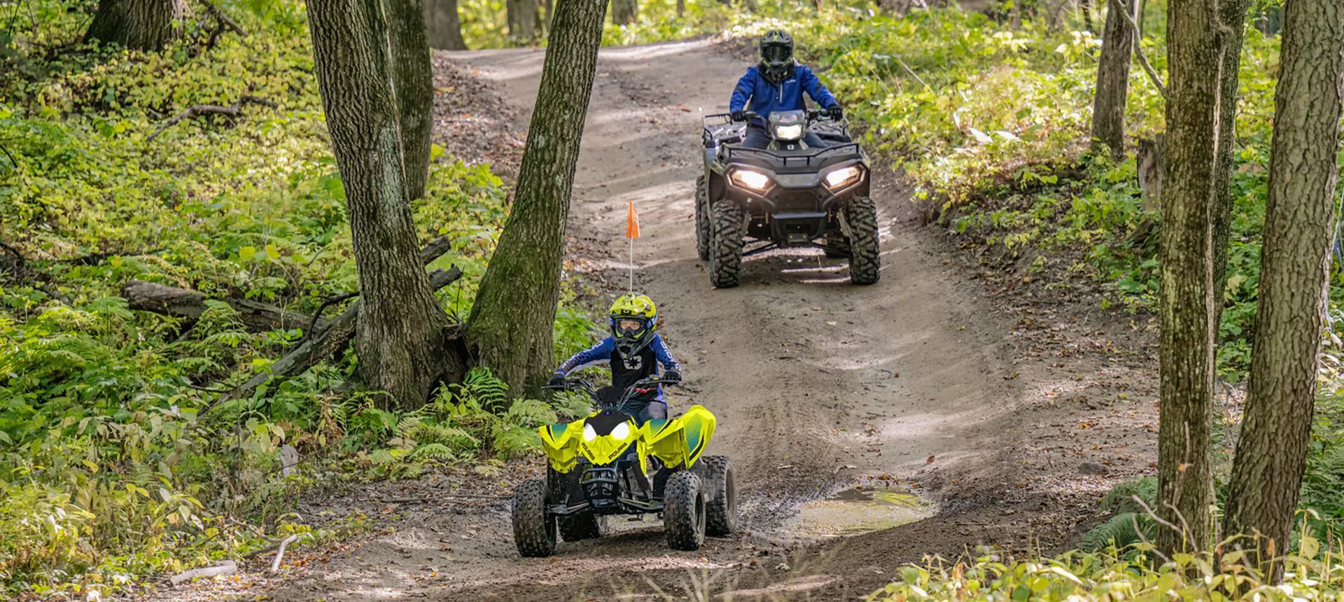 A kd leading the way on his 2026 Polaris Outlaw 110 EFI youth ATV.