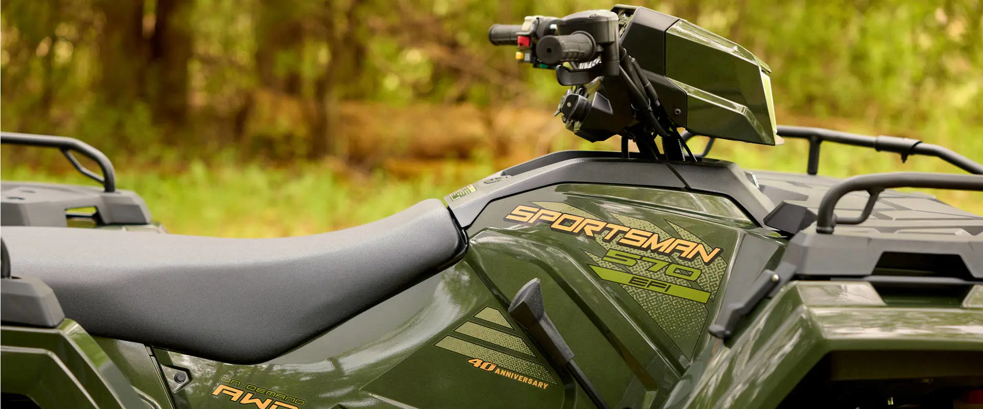 Closeup of the side and seat of a 2026 Polaris Sportsman 570 Premium 40th Anniversary Edition ATV.