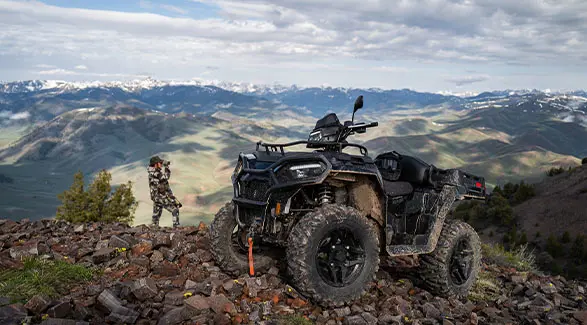 A hunter scoping a location with a 2026 Polaris Sportsman X2 570 ATV.