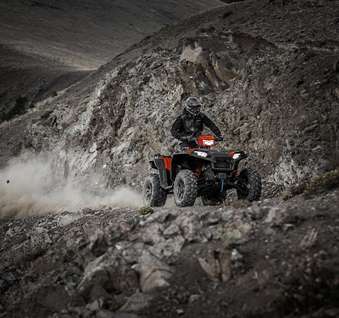 Rider on a 2026 Polaris Sportsman XP 1000 S showcasing the LED headlights. 