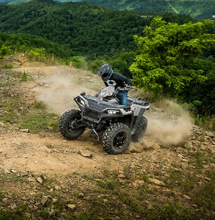 A person taking a tight corner and showcasing the nimble 48-inch width on the 2026 Sportsman XP 1000 ATV.