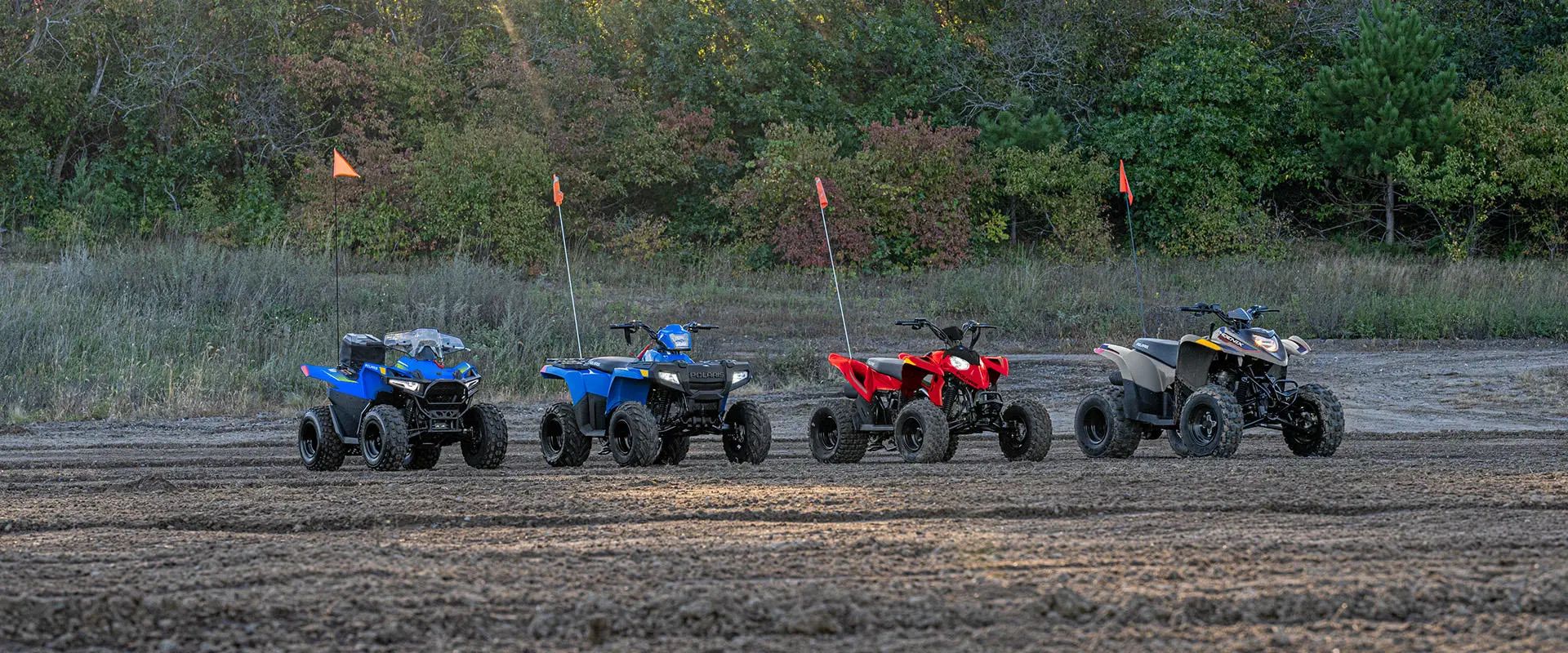 4 Polaris youth ATVs in a lineup.