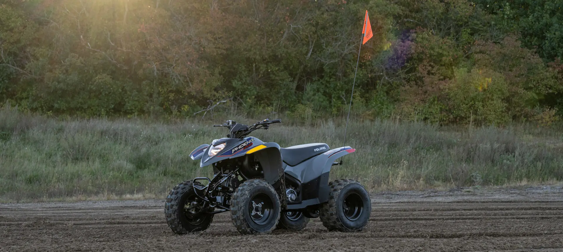 Sporty stance of the 2027 Polaris Phoenix 200 youth ATV.