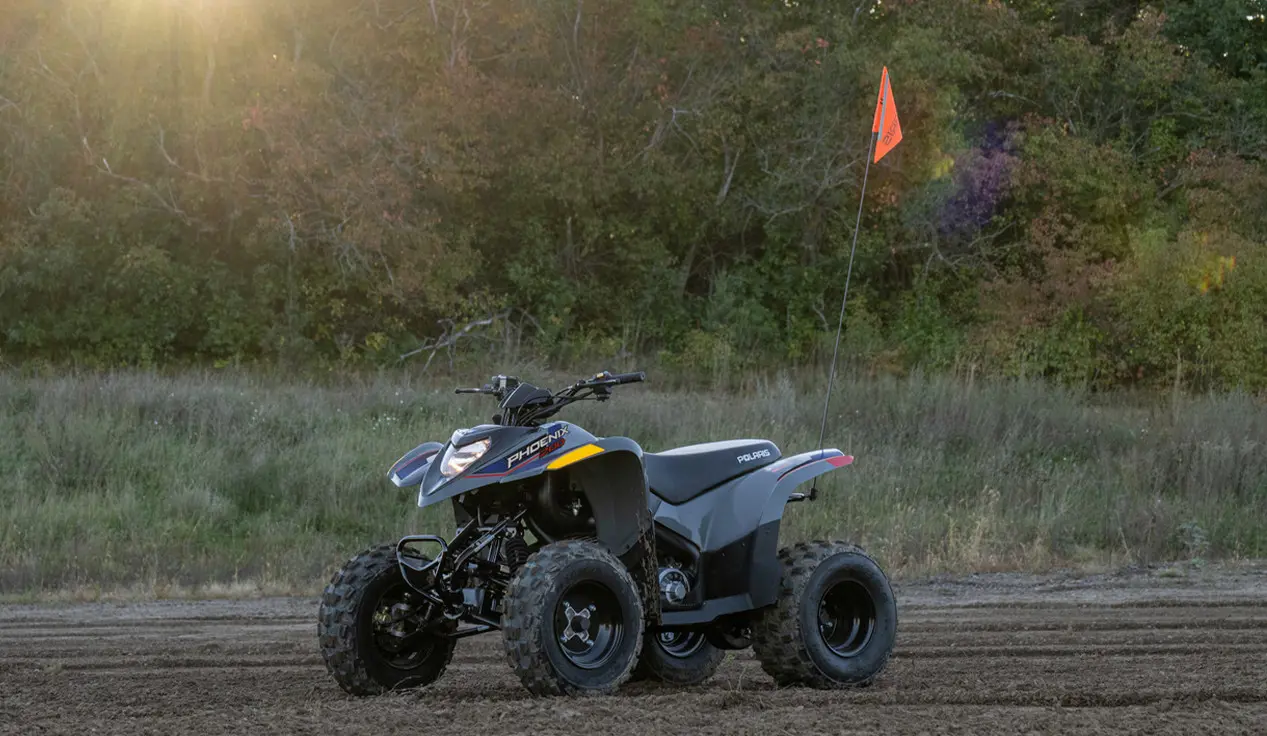 Sporty stance of the 2027 Polaris Phoenix 200 youth ATV.