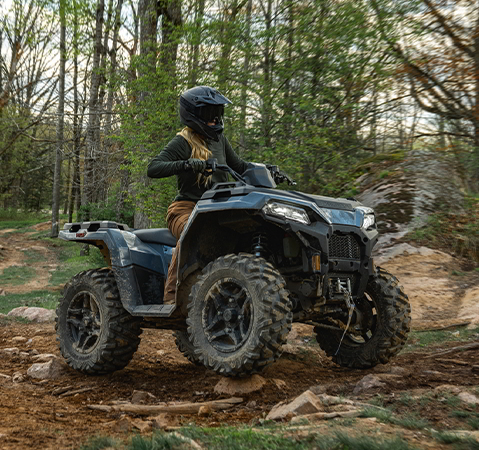 Rider on a 2027 Polaris Sportsman 500 ATV showcasing the independent rear suspension.