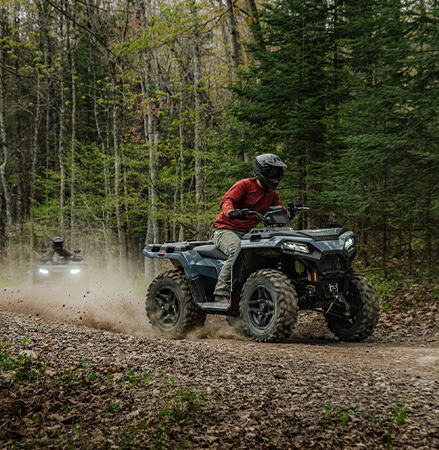 A rider on a 2027 Polaris Sportsman 500 ATV showcasing the 33HP engine.