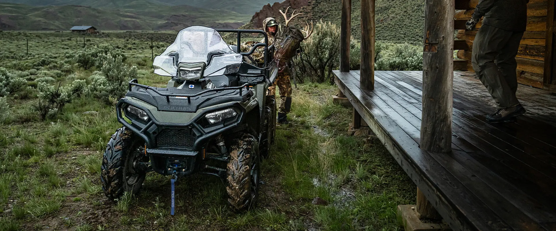 A hunting grabbing gear from the cargo box of their 2027 Polaris Sportsman 6x6 600 2-up ATV.