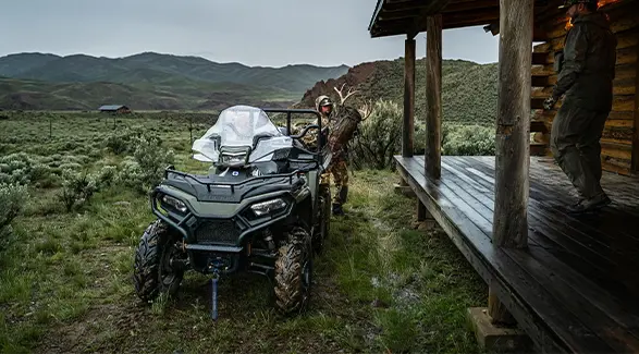 A hunting grabbing gear from the cargo box of their 2027 Polaris Sportsman 6x6 600 2-up ATV.