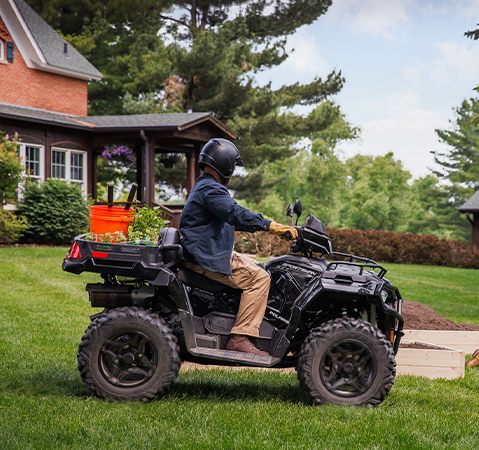 A rider using turf mode on a 2027 Polaris Sportsman X2 600 2-up ATV.