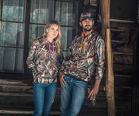 a couple wearing Polaris camo colection apparel items