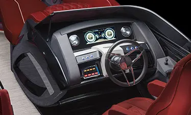 steering wheel and gauges on the helm of a bennington qx sport pontoon boat