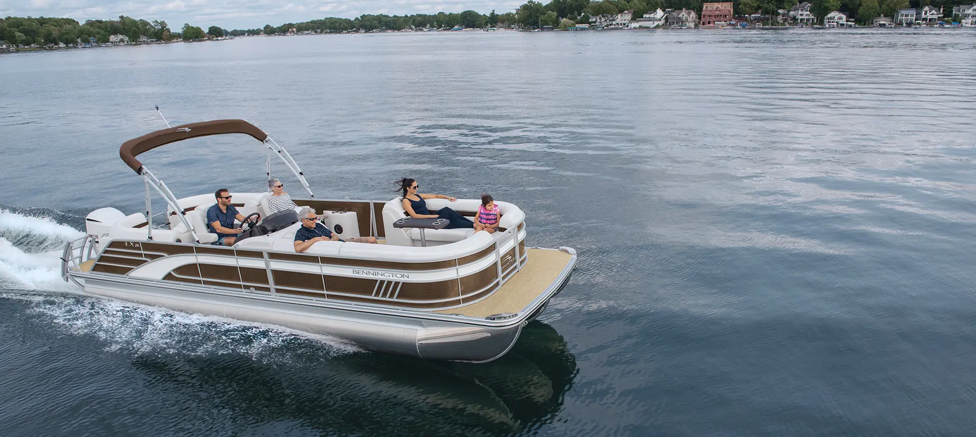 Bennington LX pontoon cruising across a lake