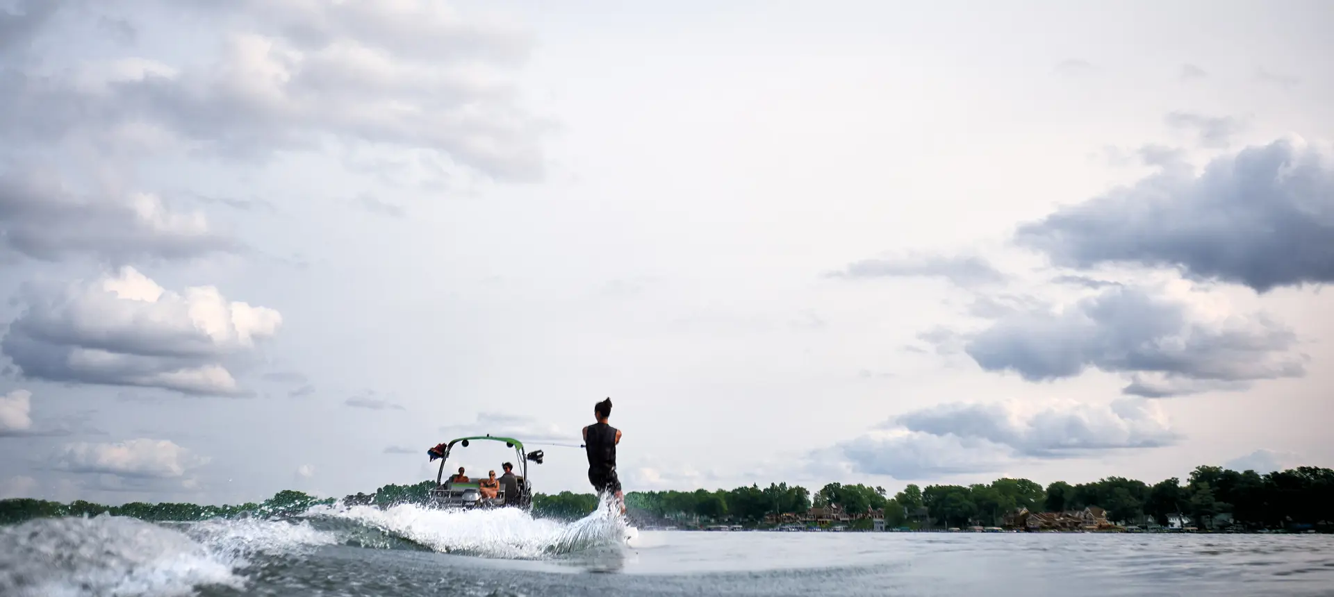 wake boarding behind a Bennington LX pontoon