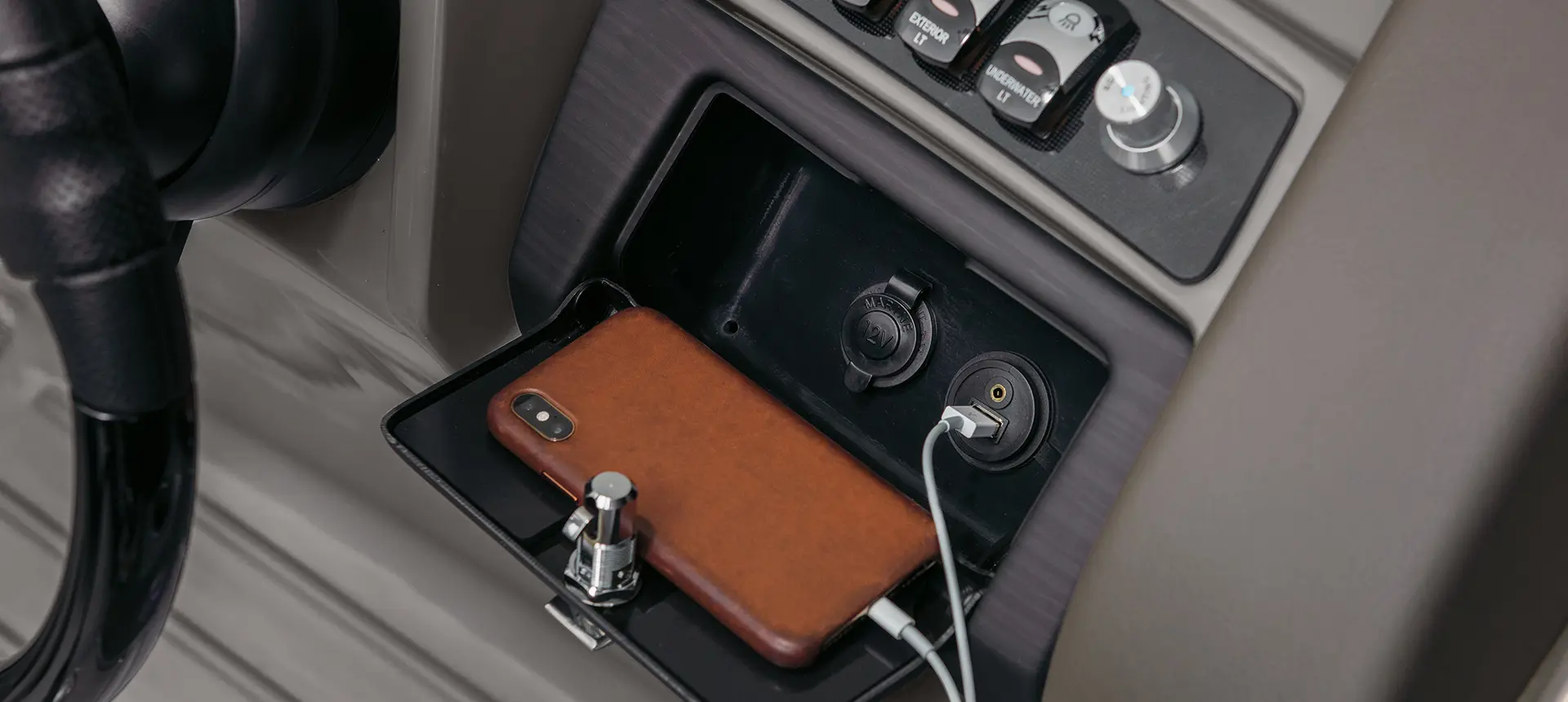phone storage and charging options on a Bennington LX pontoon