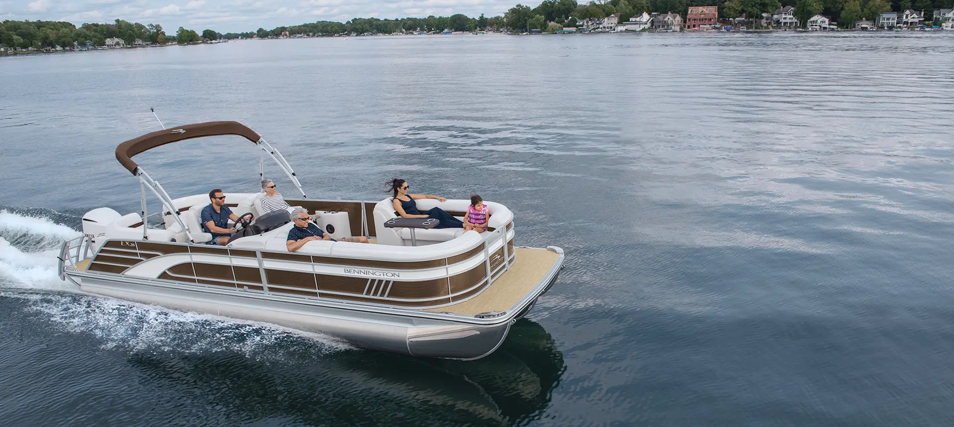 side profile of a Bennington LX pontoon on a lake