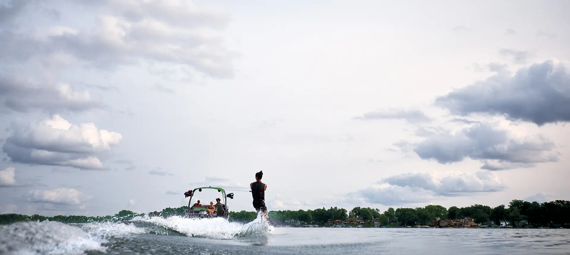 wake boarding behind a bennington lx pontoon boat