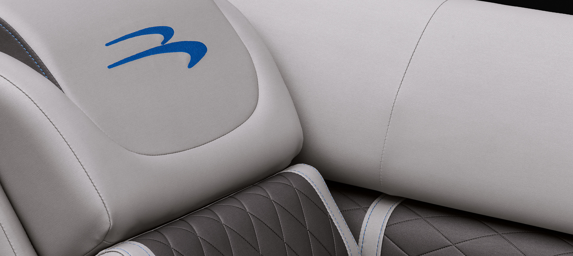 Close look of the Bennington logo in the seats of the LX boat