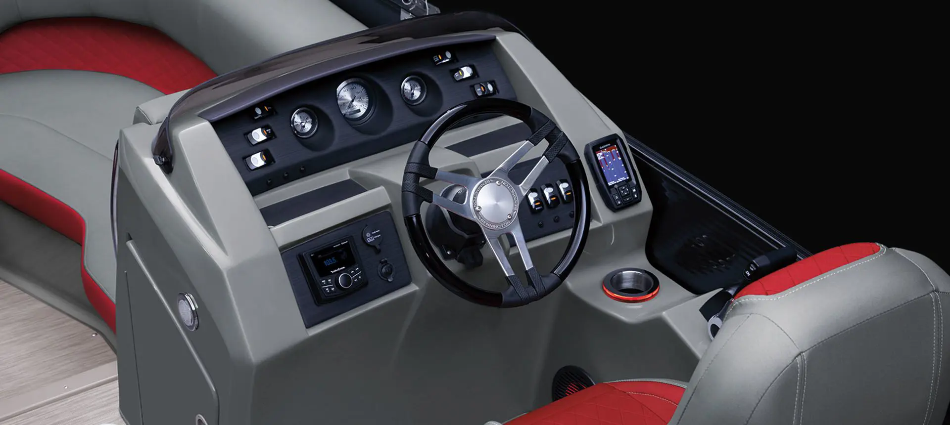 steering wheel and gauges on the helm of a bennington l bowrider pontoon boat