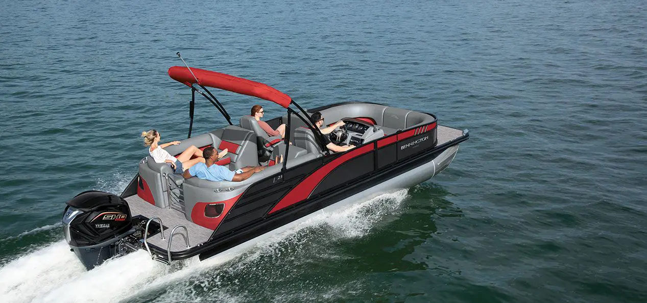 red and black bennington l bowrider pontoon boat cruising on a lake