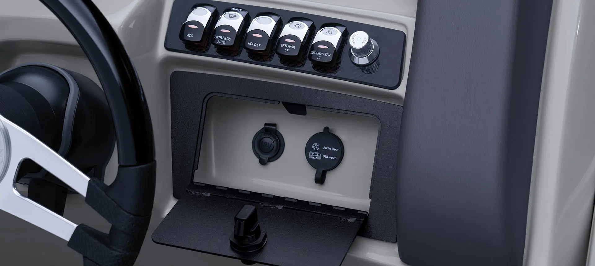 switches on the steering console on a bennington lx pontoon boat