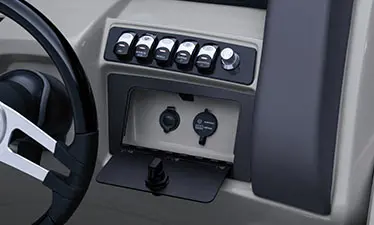 switches on the steering console on a bennington lx pontoon boat