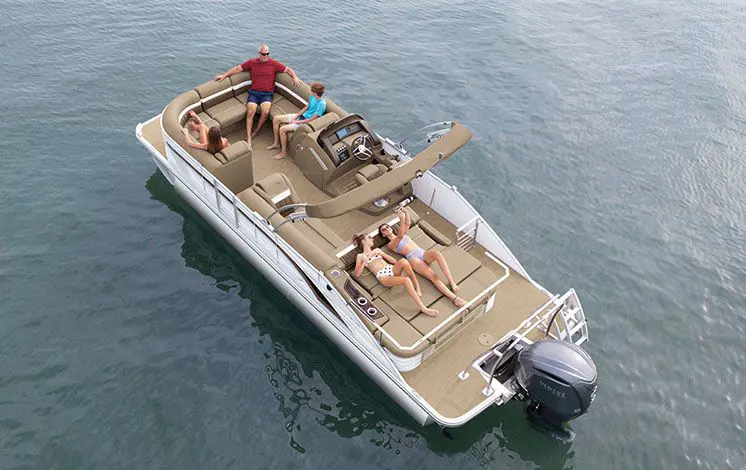 aerial view of a family relaxing on a bennington lx pontoon boat on a lake
