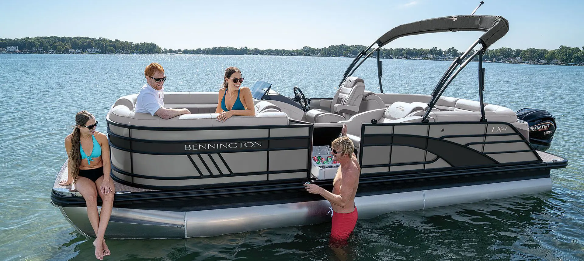 friends hanging out around a bennington lx pontoon boat