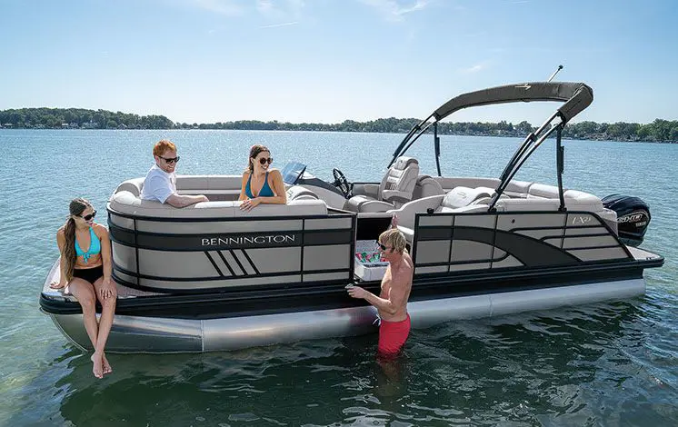friends hanging out around a bennington lx pontoon boat