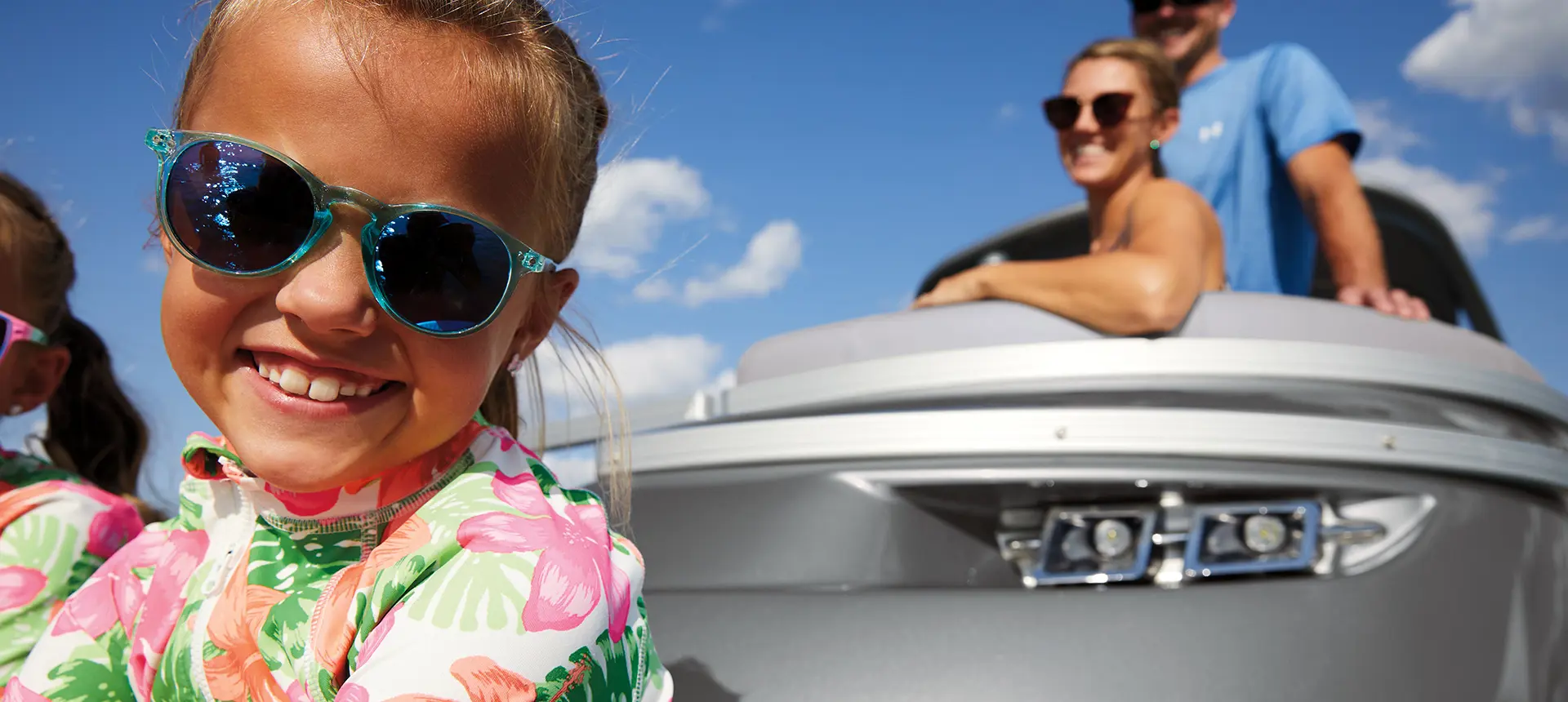 close up of a kid smiling on a Bennington Q Pontoon Boat