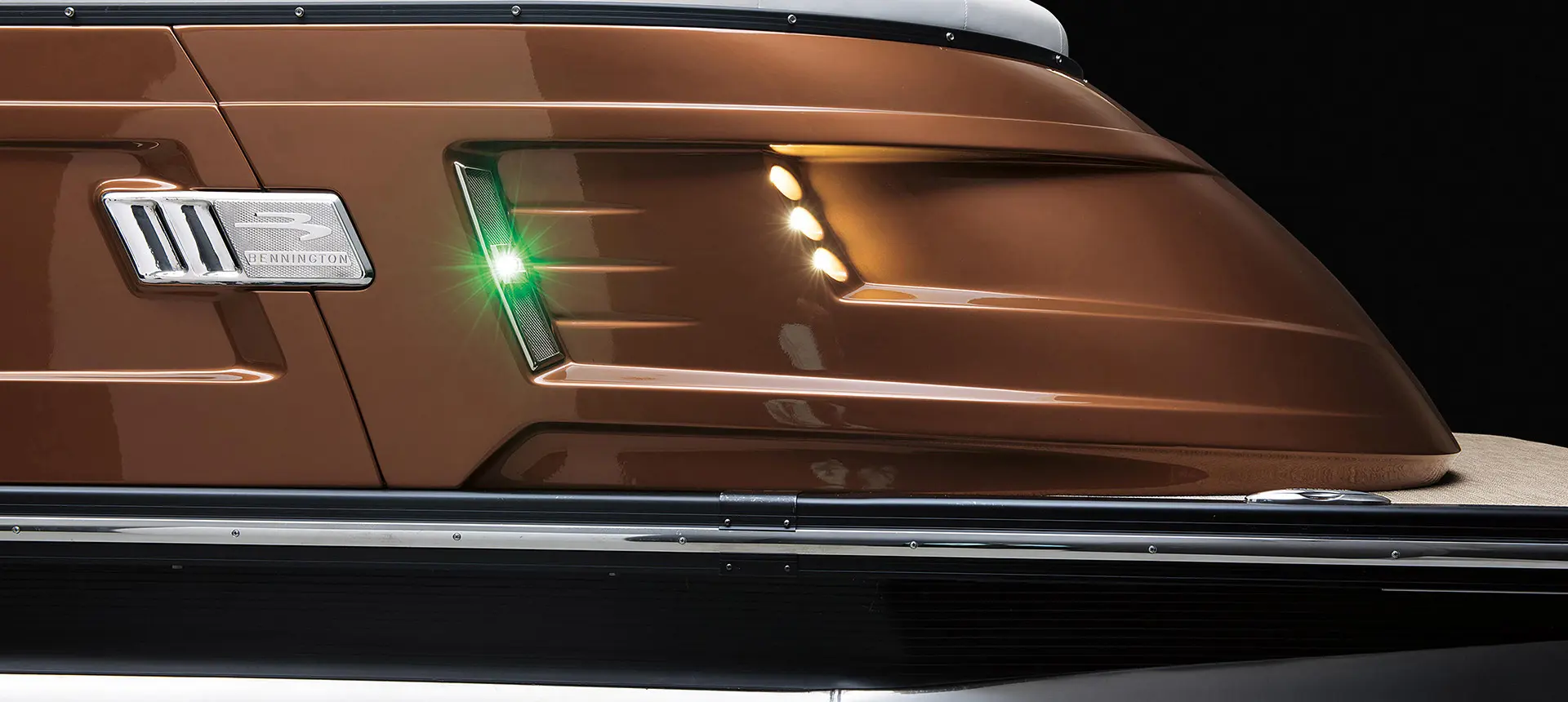 close look at the lights on the side of a Bennington QX pontoon