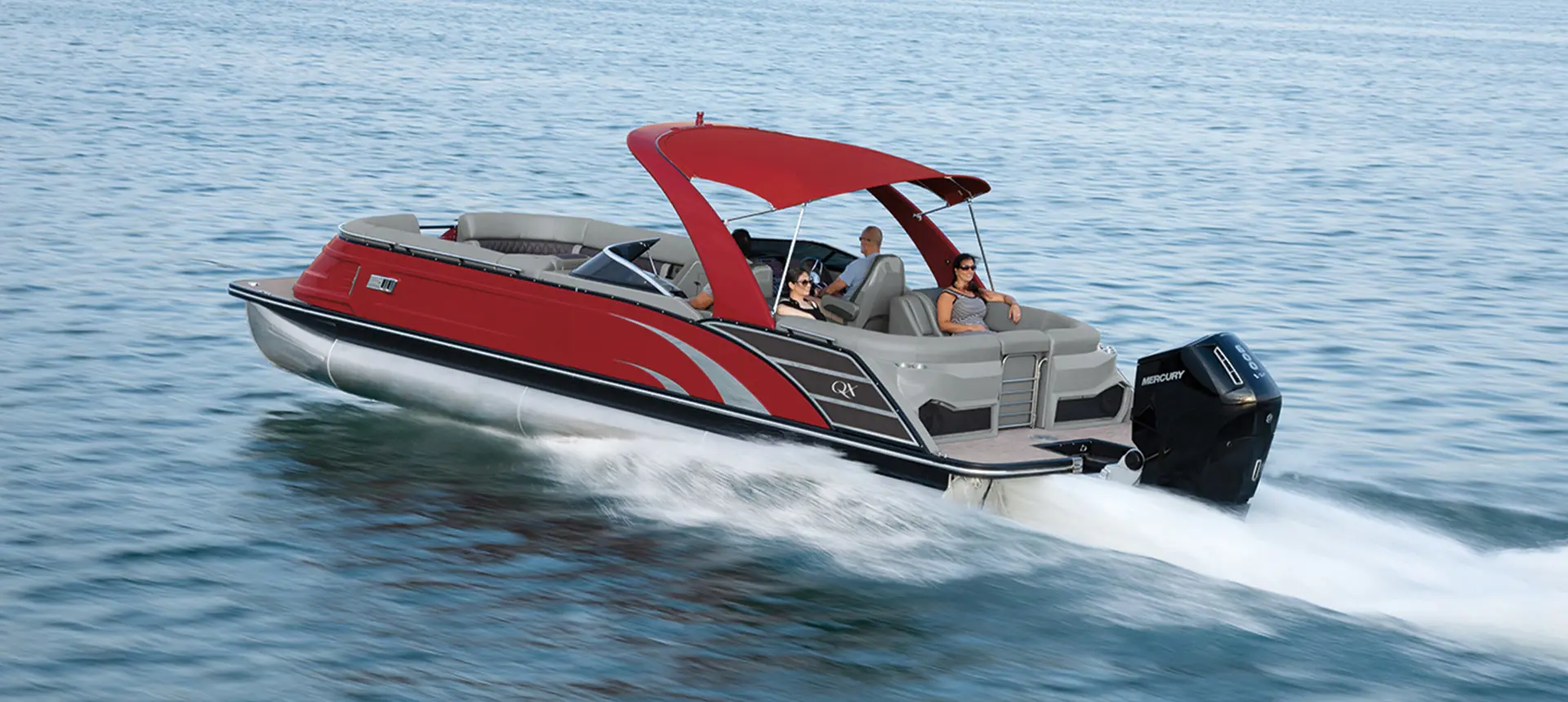 Bennington QX pontoon cruising across a lake